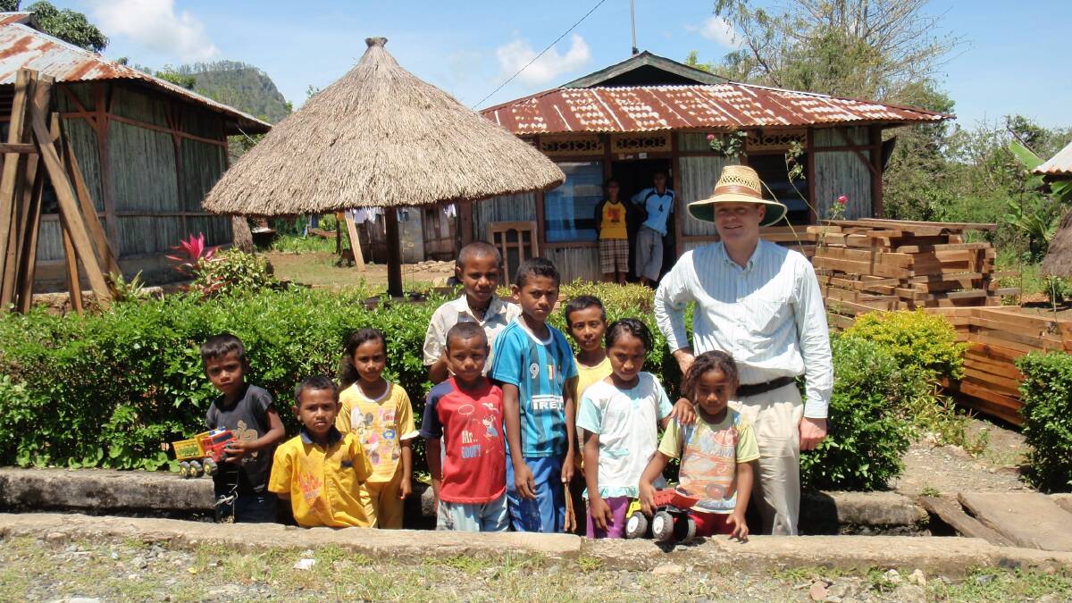 Local children welcome Dr David O'Rourke into their village in West Timor. Picture: Supplied