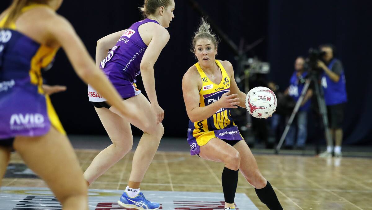 Lightning's Laura Scherian looks for options against the Firebirds. Picture: AAP