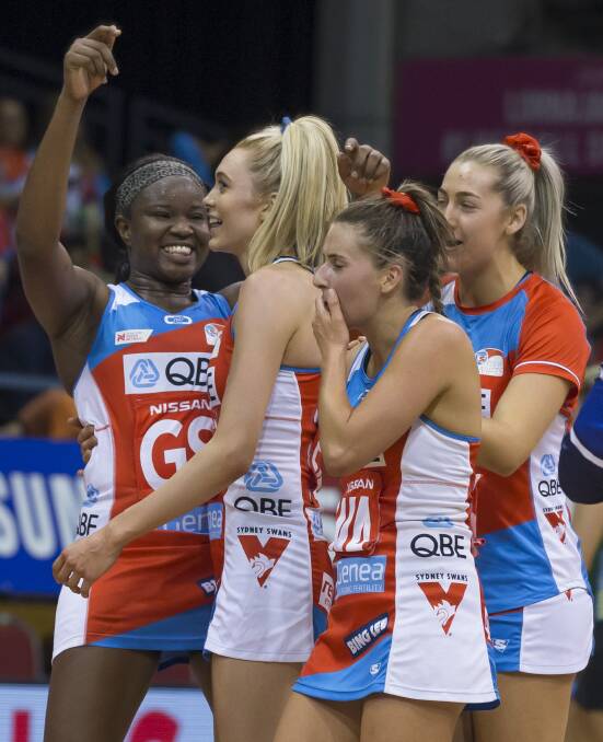 Sam Wallace and the Swifts celebrate after their win against the Fever. Picture: AAP