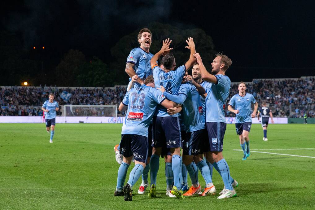 Sydney FC celebrate an Alex Brosque goal in Sunday's mauling of Melbourne Victory. Picture: AAP