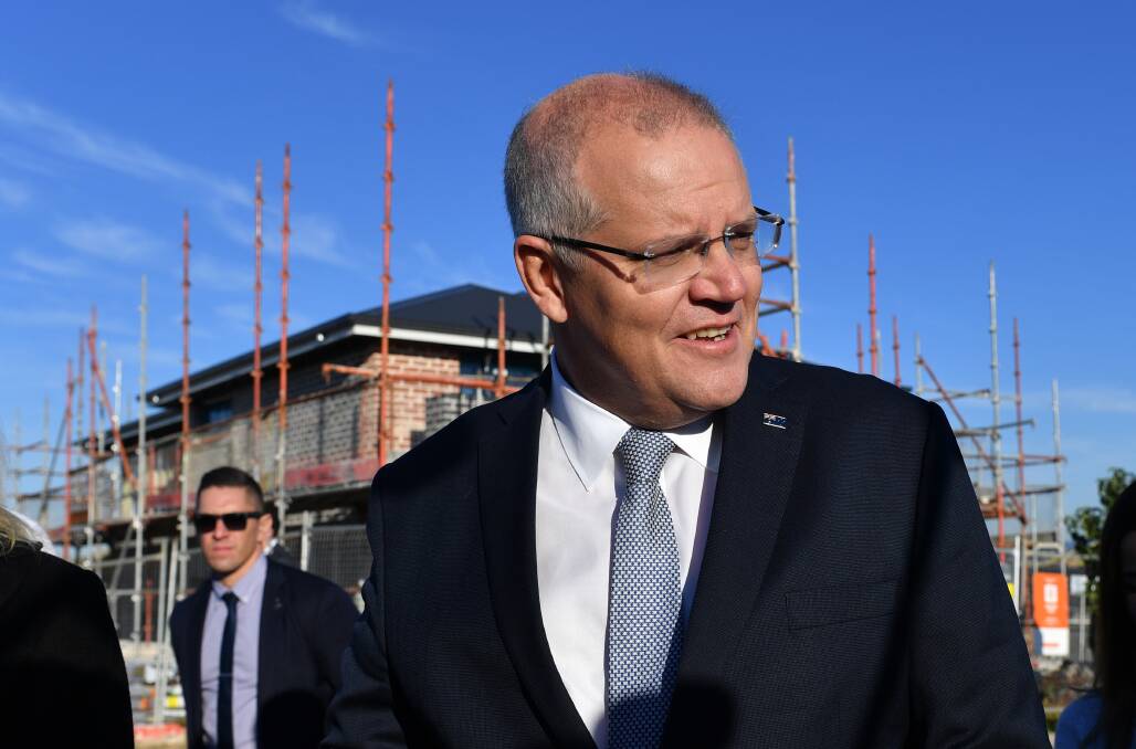 Prime Minister Scott Morrison visited a residential building site in Sydney on Monday to speak to families about the Coalition's housing policy. Picture: AAP