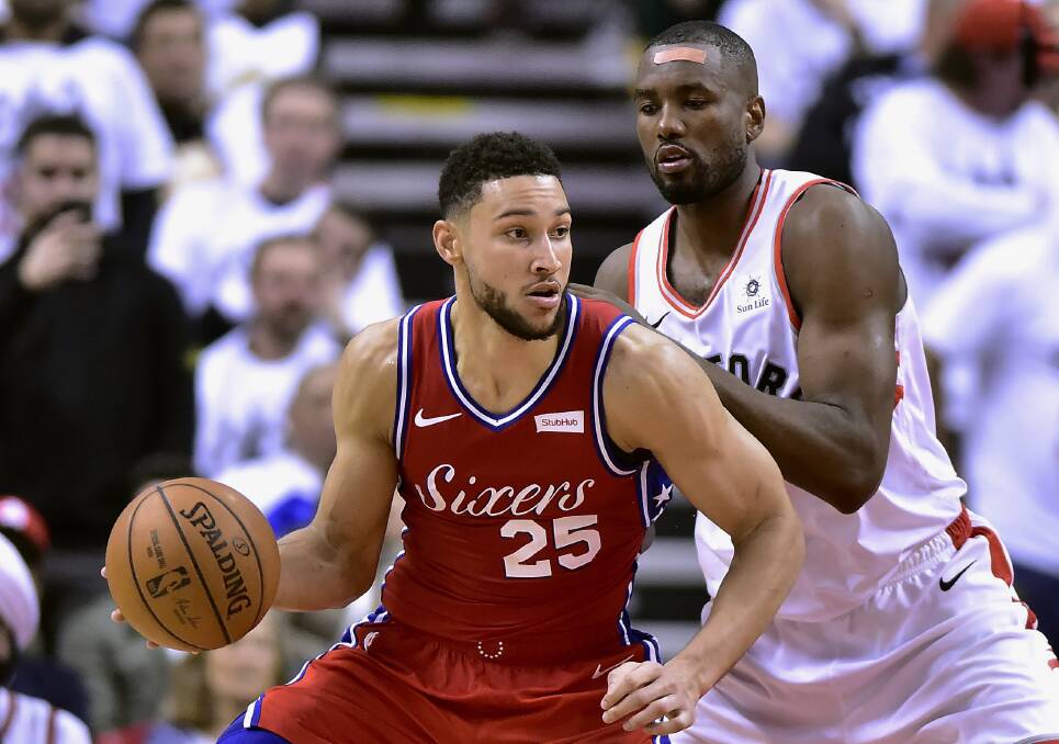 Toronto Raptors center Serge Ibaka (9) charges Philadelphia 76ers guard Ben Simmons (25) in game seven. Picture: AP