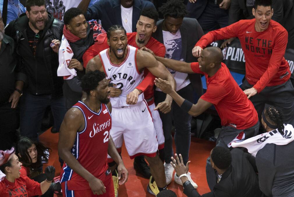Toronto Raptors forward Kawhi Leonard, centre, reacts with teammates after making the game-winning shot. Picture: AP