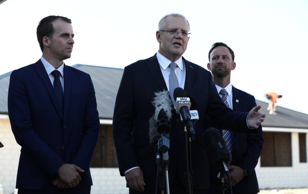Prime Minister Scott Morrison, flanked by the Liberal candidate for Cowan Isaac Stewart and Liberal candidate for Stirling Vince Connelly. Picture: Dominic Lorrimer