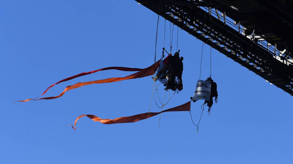 Greenpeace activists under the Sydney Harbour Bridge. Picture: AAP/Dean Lewins