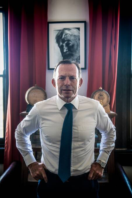 Former prime minister, Tony Abbott, in front of a portrait of Ernest Hemingway. Picture: Nick Moir