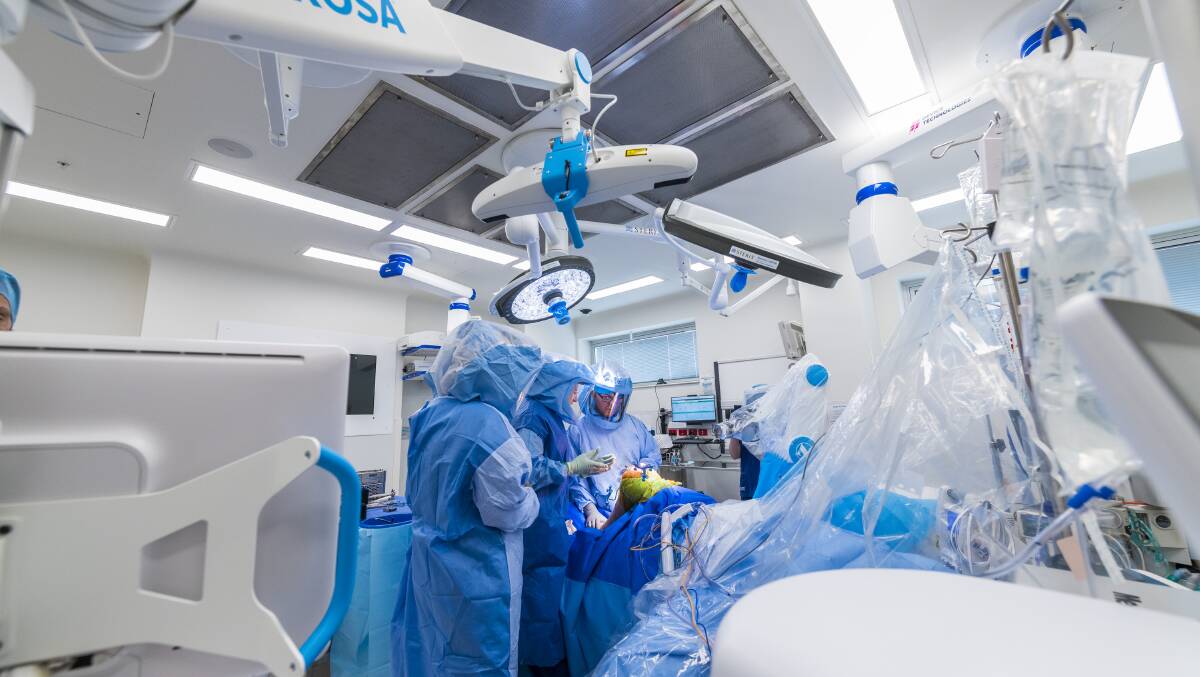 An image taken during Beverly Webb's total knee replacement surgery under the knife of Dr Brendan Klar and ROSA, the robot. Picture: Supplied