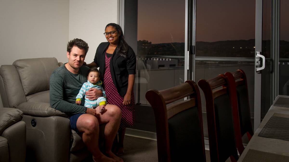 Thomas Fuller with his five-month-old son Judah and partner Annie Rajadurai. They have recently bought an apartment, so miss out on both major parties' promised changes to first-time buyer deposits. Picture: Elesa Kurtz