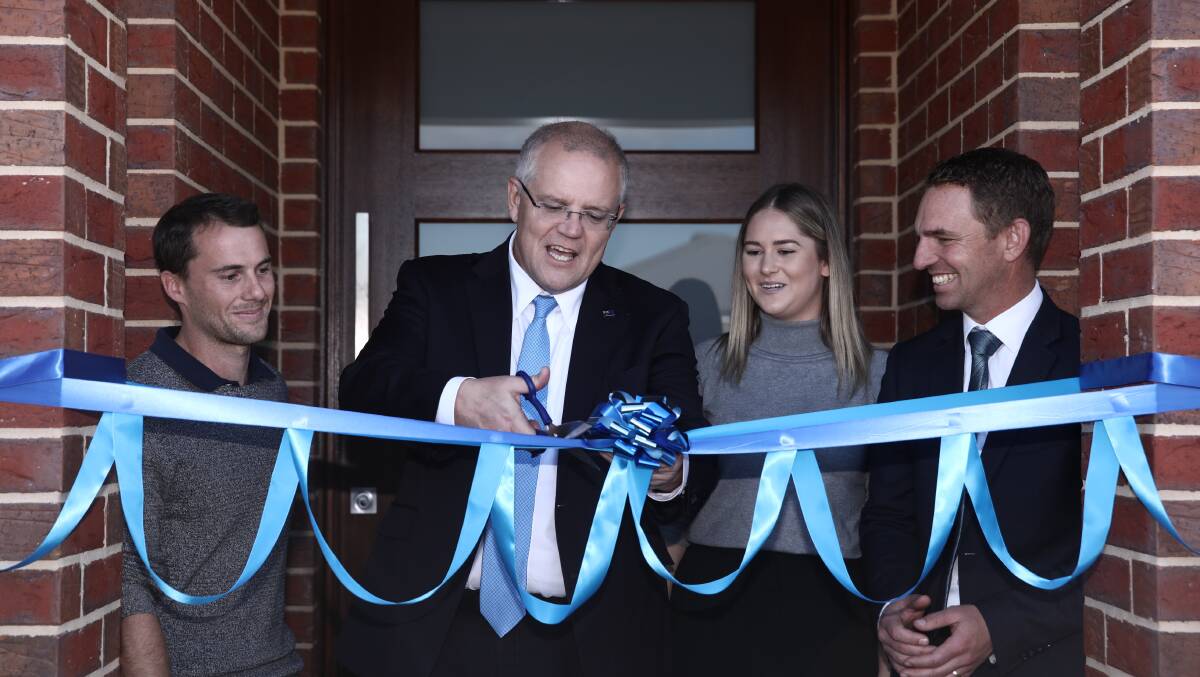 Prime Minister Scott Morrison and Federal Liberal Candidate for Indi Steve Martin visit first home owners Andy and Caitlin at their new home in Wangaratta, Victoria, on Wednesday. Picture: Dominic Lorrimer