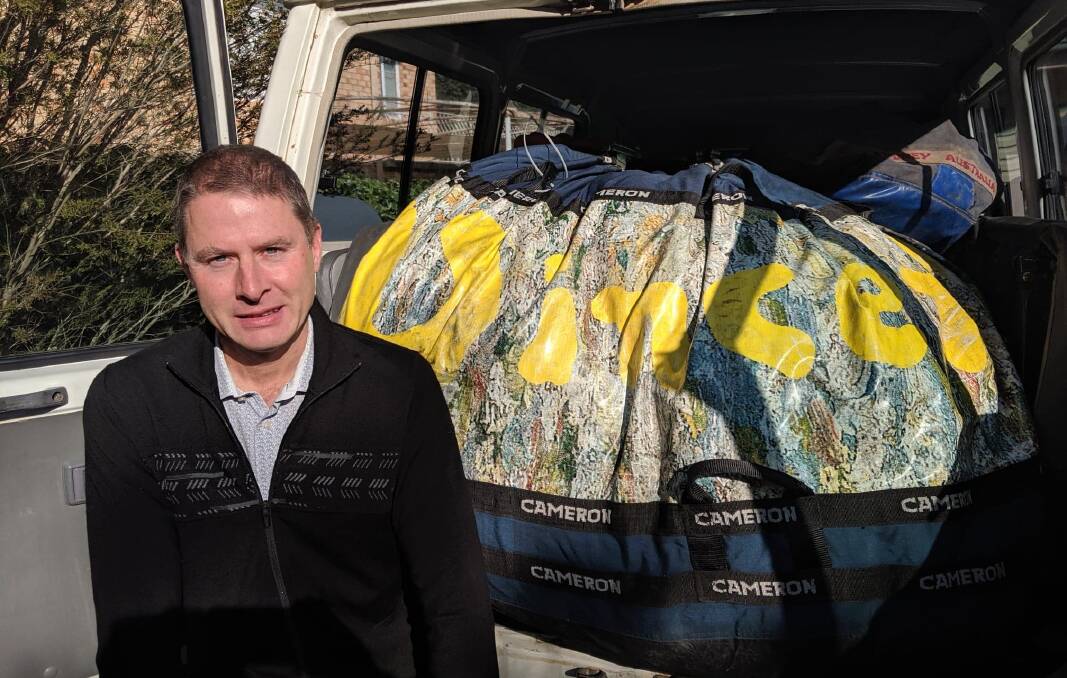 Paul Gibbs with the Vincent Van Gogh hot-air balloon which will be let out of the bag on Monday, weather permitting.