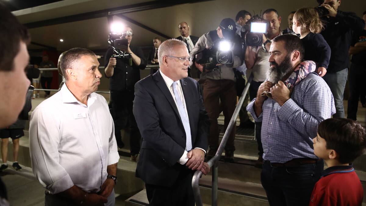 Prime Minister Scott Morrison and federal Liberal candidate for Longman Terry Young in Brisbane on Thursday. Picture: Dominic Lorrimer