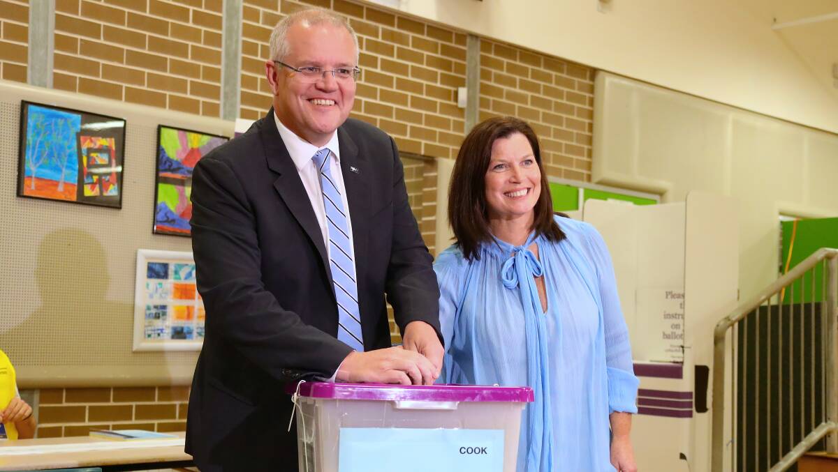 Prime Minister Scott Morrison poses for photographs with his wife Jenny during the federal election in May. Picture: David Gray/Bloomberg