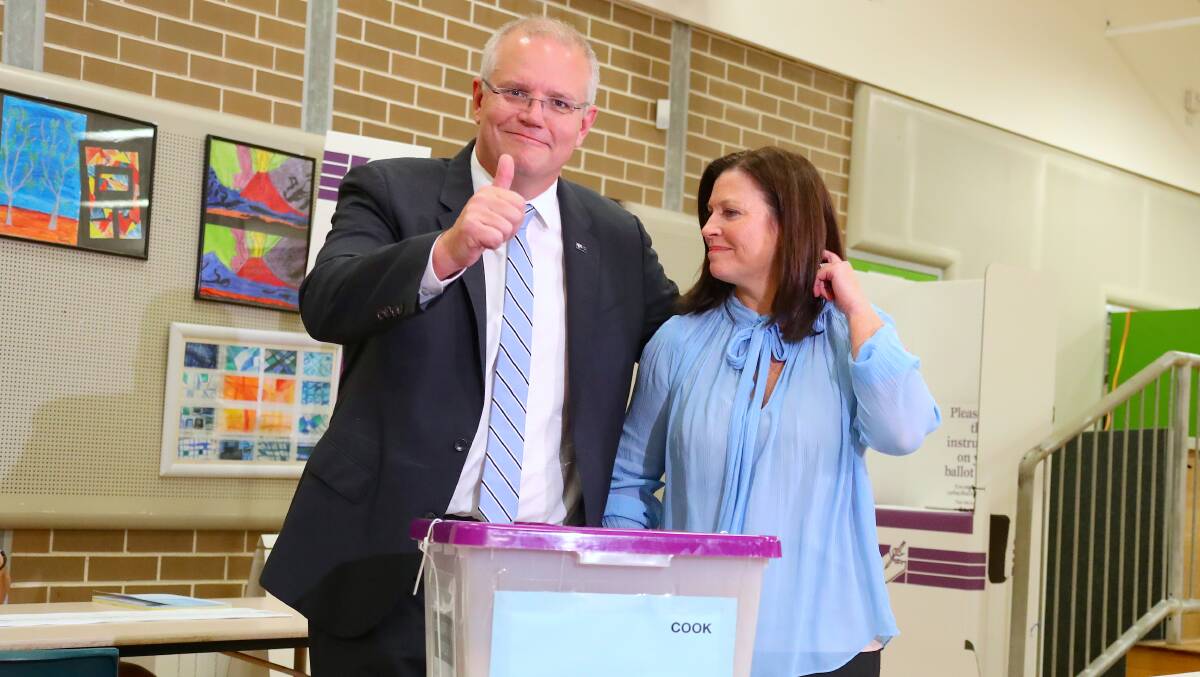 Scott Morrison, with wife Jenny, was sharp and effective in this election campaign by making himself a small target and turning every question into a personal contest against Bill Shorten. Picture: David Gray/Bloomberg