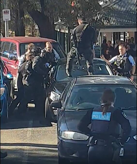 ACT Police arrest a man who allegedly attempted to carjack a woman at Kambah Shops. Picture: Jade Walters