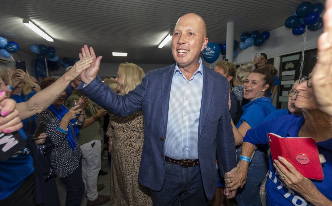 Home Affairs Minister Peter Dutton celebrates his return to the seat of Dickson while in Strathpine on election night. Picture: AAP Image/Glenn Hunt