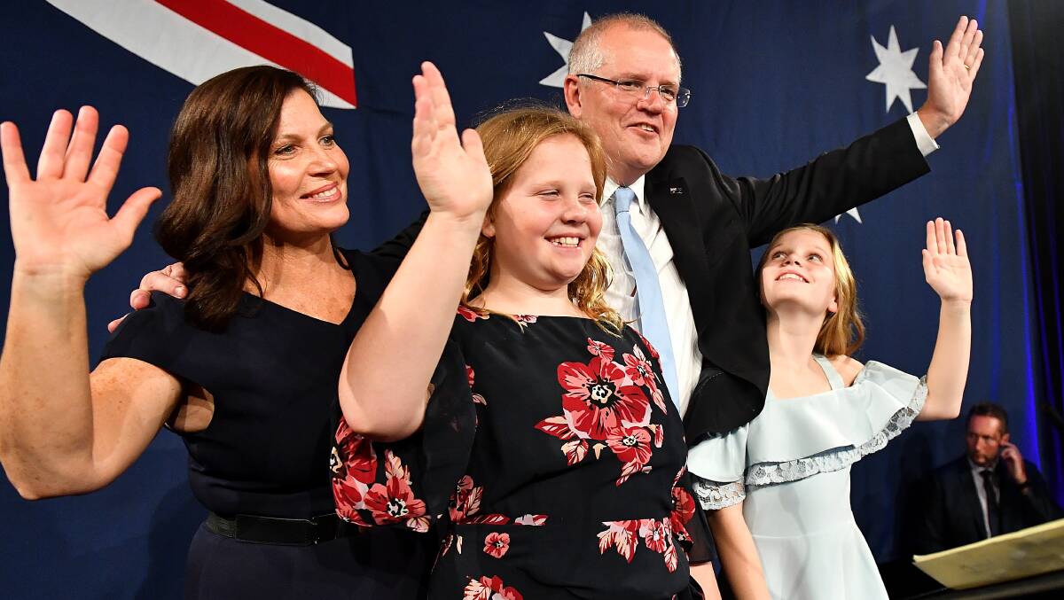 Scott Morrison takes to the stage with wife Jenny and children Abbey and Lily to declare victory. Picture: AAP