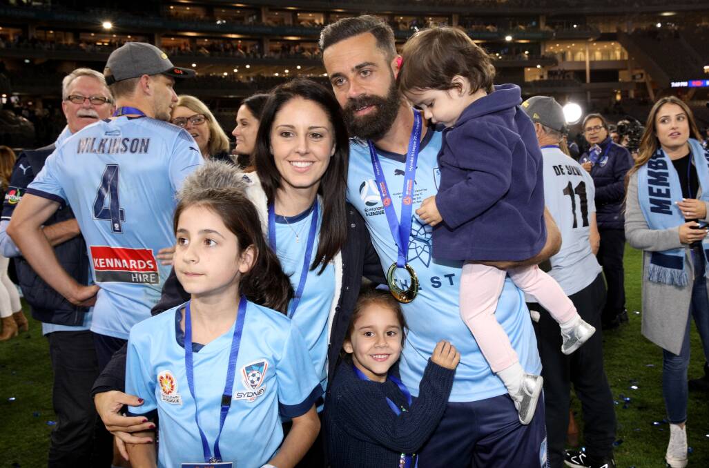 Alex Brosque celebrates Sydney FC's grand final win with his family. Picture: AAP