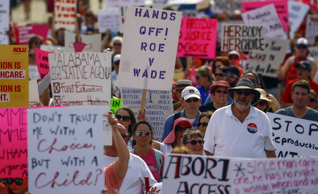 Protesters march to the Alabama Capitol to protest a law passed last week making abortion a felony in nearly all cases with no exceptions for cases of rape or incest. Picture: AP