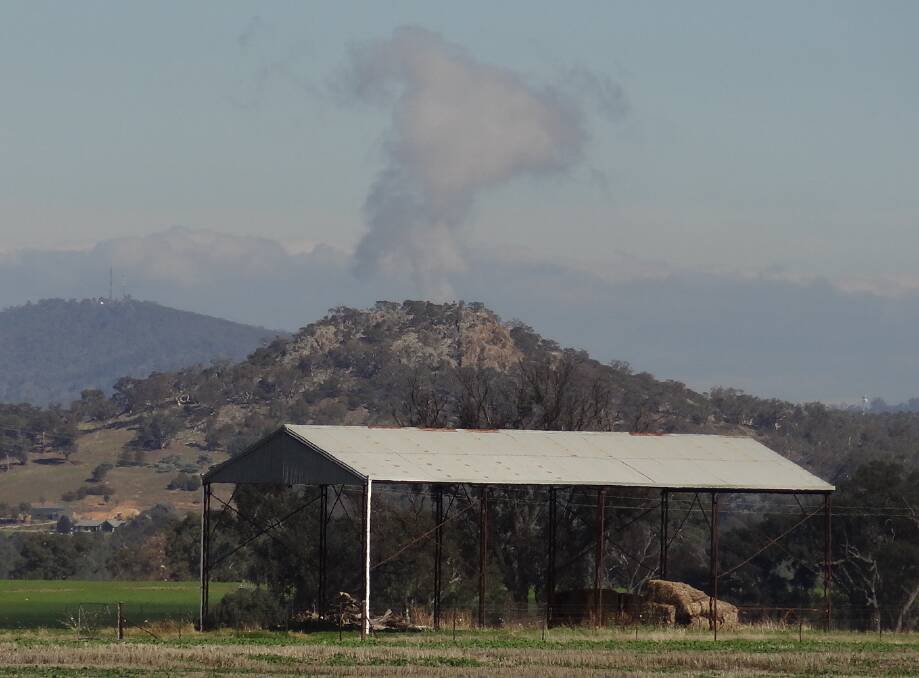 Big Budginigi Hill near Albury doing its best impersonation of a volcano. Picture: Jonathan Miller