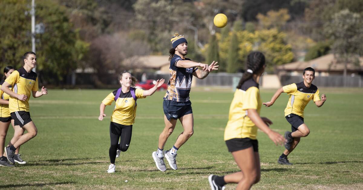 Andy Muirhead plays buroinjin at Mount Stromlo high on Tuesday. Picture: Sitthixay Ditthavong