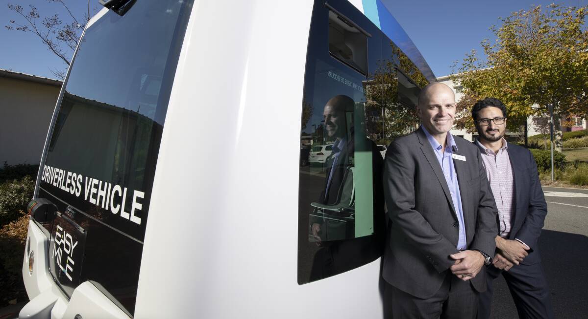 IRT Group CEO Patrick Reid and managing director Greg Giraud with one of their driverless buses being tested at IRT Kangara Waters in Belconnen. Picture: Sitthixay Ditthavong