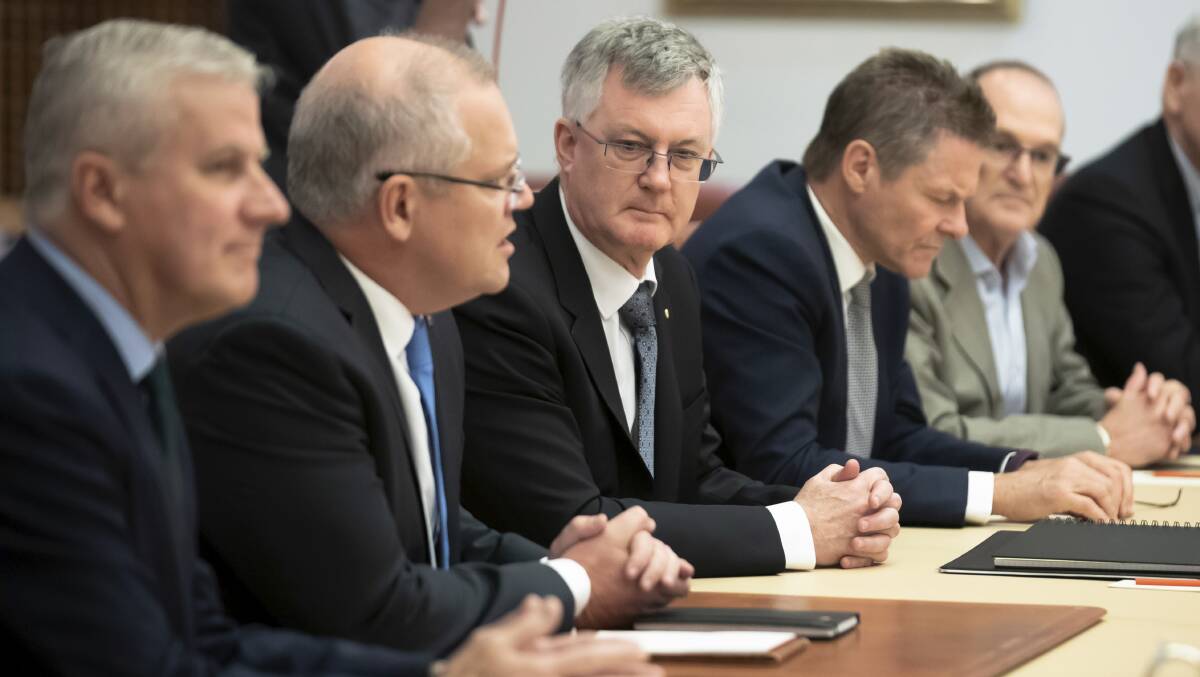 Prime Minister Scott Morrison sits with senior public servants Martin Parkinson, Peter Woolcott and Phil Gaetjens after the Coalition's re-election in May. Picture: Alex Ellinghausen.