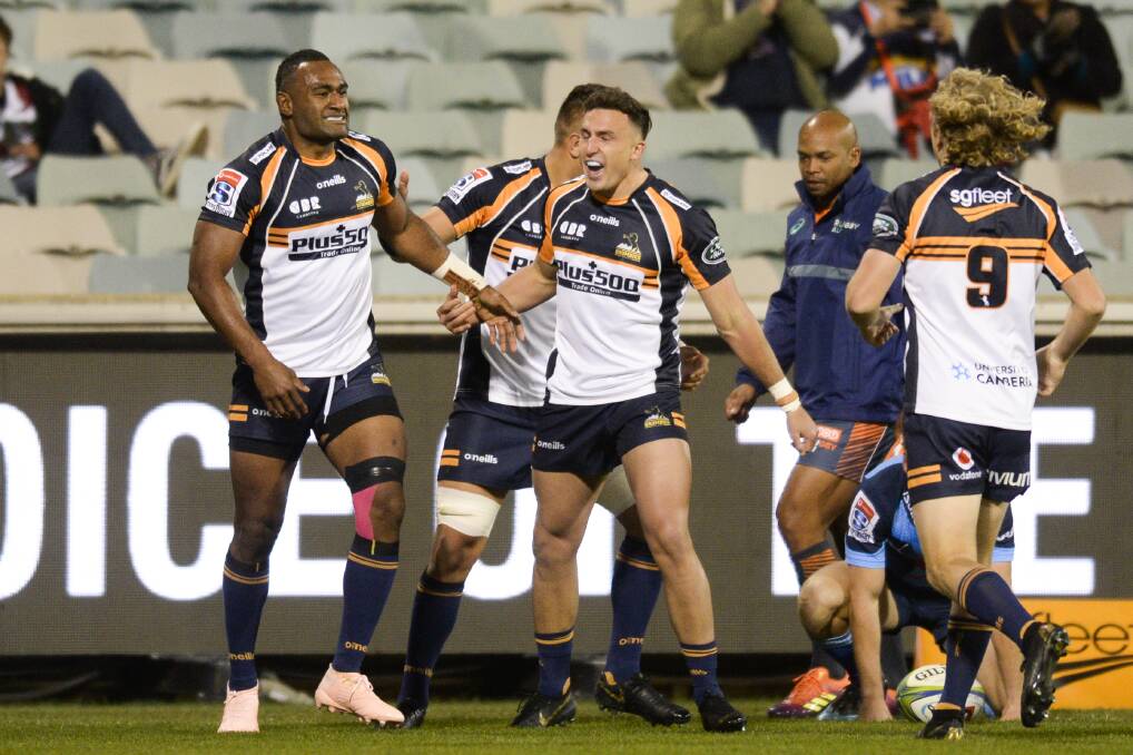 The Brumbies celebrate a Tevitai Kuridrani, left, try in the first half against teh Bulls. Picture: AAP