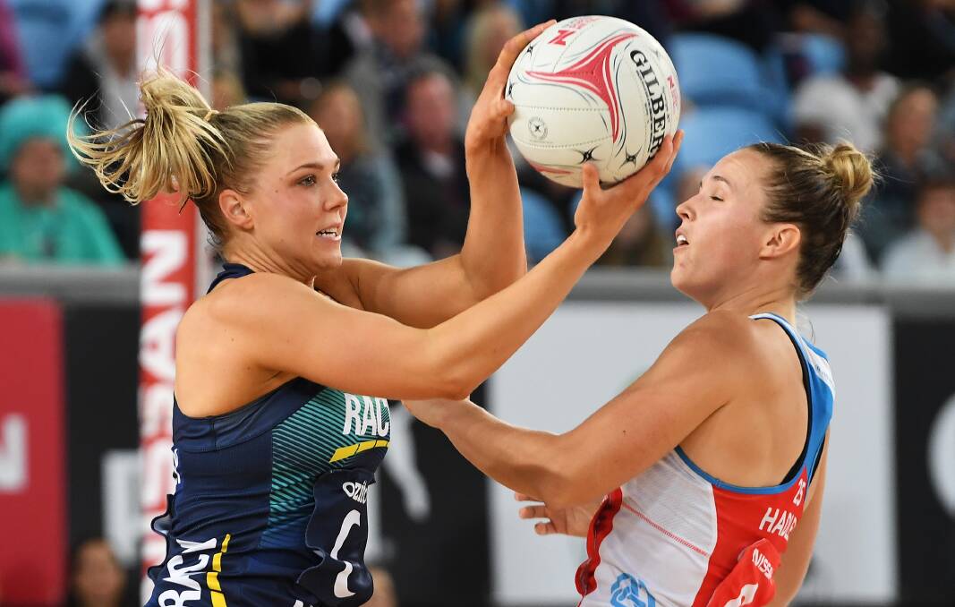 Kate Moloney (left) of the Vixens beats the Swifts' Paige Hadley to the ball. Picture: AAP