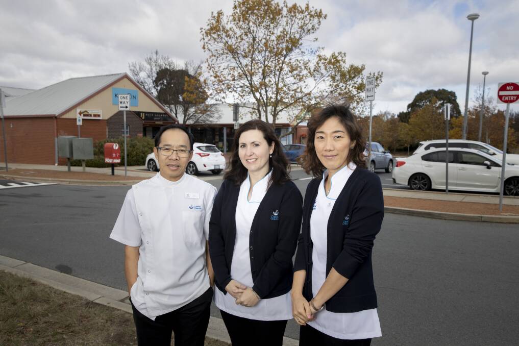 Capital Chemist Palmerston owner Tam Le, and pharmacists Claire Anstie and Sarah Son, who are concerned about the impact of parking constraints at Palmerston Shops on their business. Picture: Sitthixay Ditthavong
