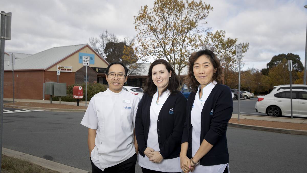 Capital Chemists pharmacists Tam Le, Claire Anstie, and Sarah Son raised concerns in June about the impact of parking constraints at Palmerston shops on their business. Picture: Sitthixay Ditthavong