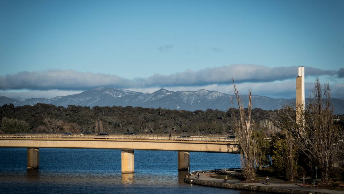 Canberra has shivered through its coldest morning of the year. The conditions has led to a light dusting of snow on the Brindabellas, seen over the Commonwealth avenue bridge. Picture Karleen Minney