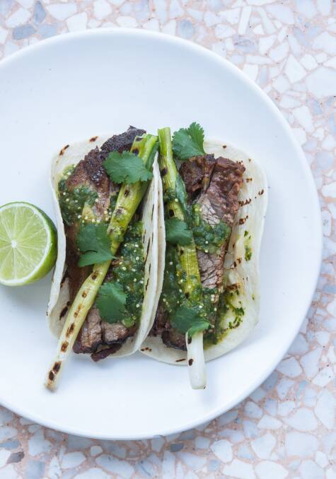 Slow-cooked brisket taco with grilled spring onion and tomatillo salsa verde. Picture: Simon Schluter 