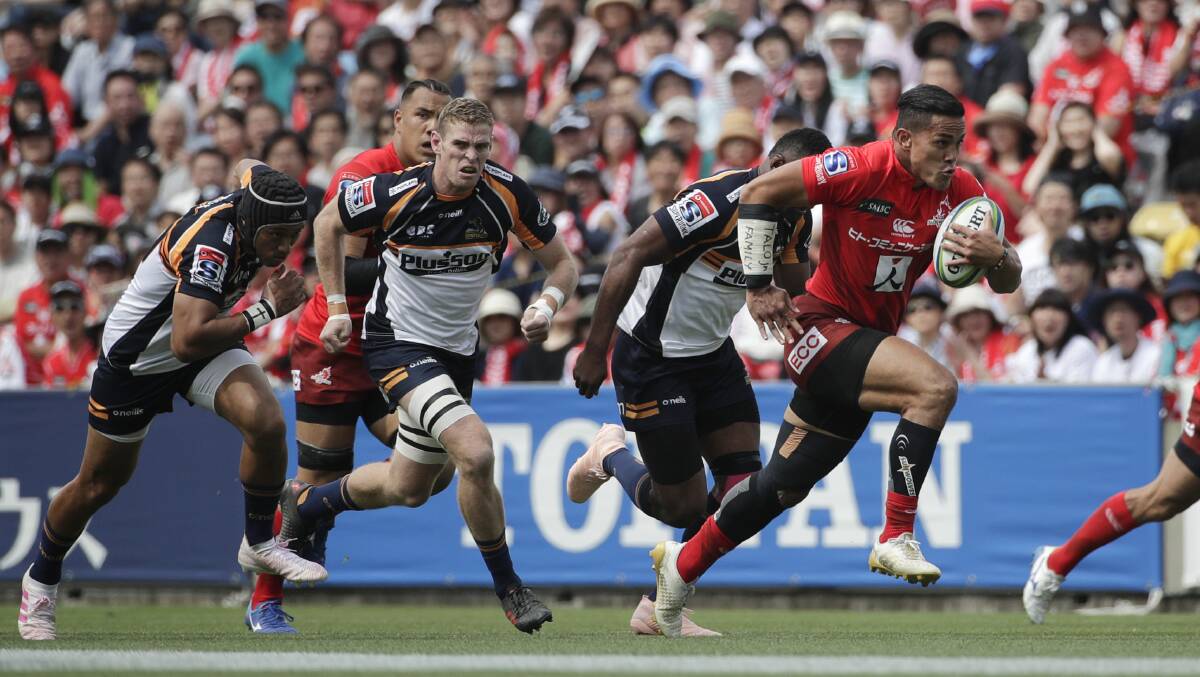 Sunwolves' Hosea Saumaki, right, scores the first try of the game against the Brumbies. Picture: AP Photo/Jae C. Hong