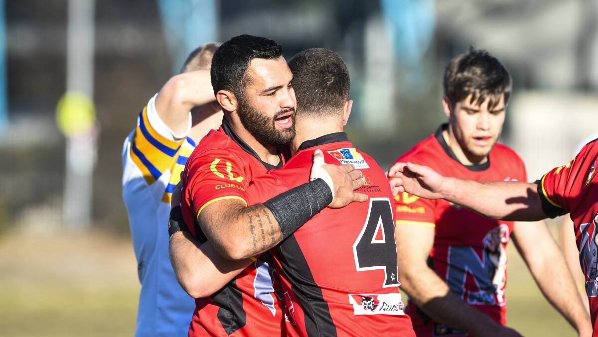 Alex Pettit celebrates with his team after scoring a try. Picture: Dion Georgopoulos