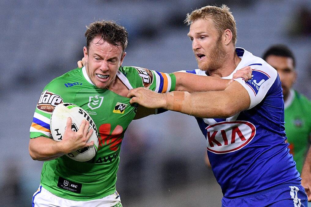 Sam Williams, of the Raiders, is tackled by Aiden Tolman, of the Bulldogs. Picture: AAP