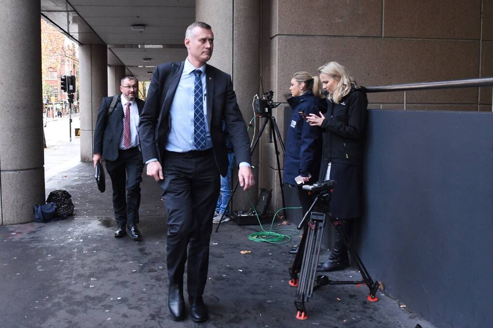 AFP officers arrive at the ABC offices, where they spent the afternoon sifting through thousands of documents related to an ABC investigation. Picture: Kate Geraghty