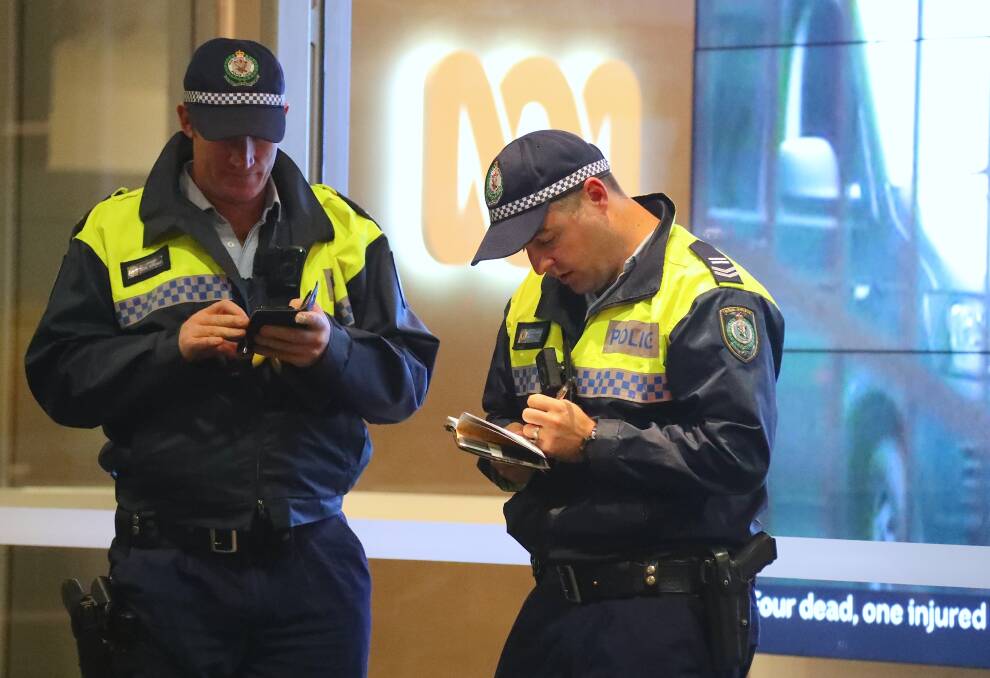 Two policemen outside the ABC building located at Ultimo in Sydney. Picture: AAP