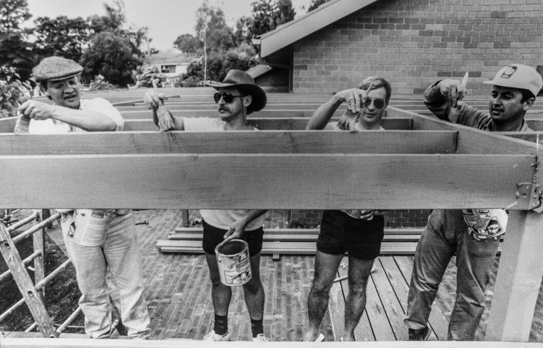 Apex Club volunteers (from left) Patrick Flaton, Steve Hannaford, Chris Evans and Neil Thompson painting Hartley Court. 1990.