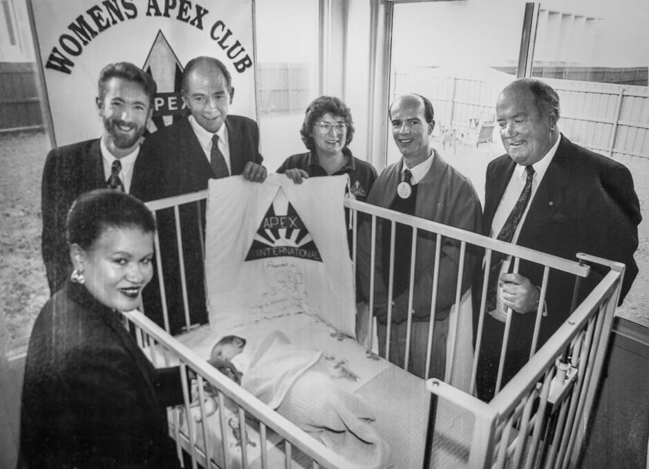 Pictured with baby Tiahna-Mia Richens are nursing director Judy Jacobs, MLAs Andrew Whitecross and Wayne Berry, and Apex members Bridget Lynam, Matt Kraefft and MLA Harold Hird. 1996.
