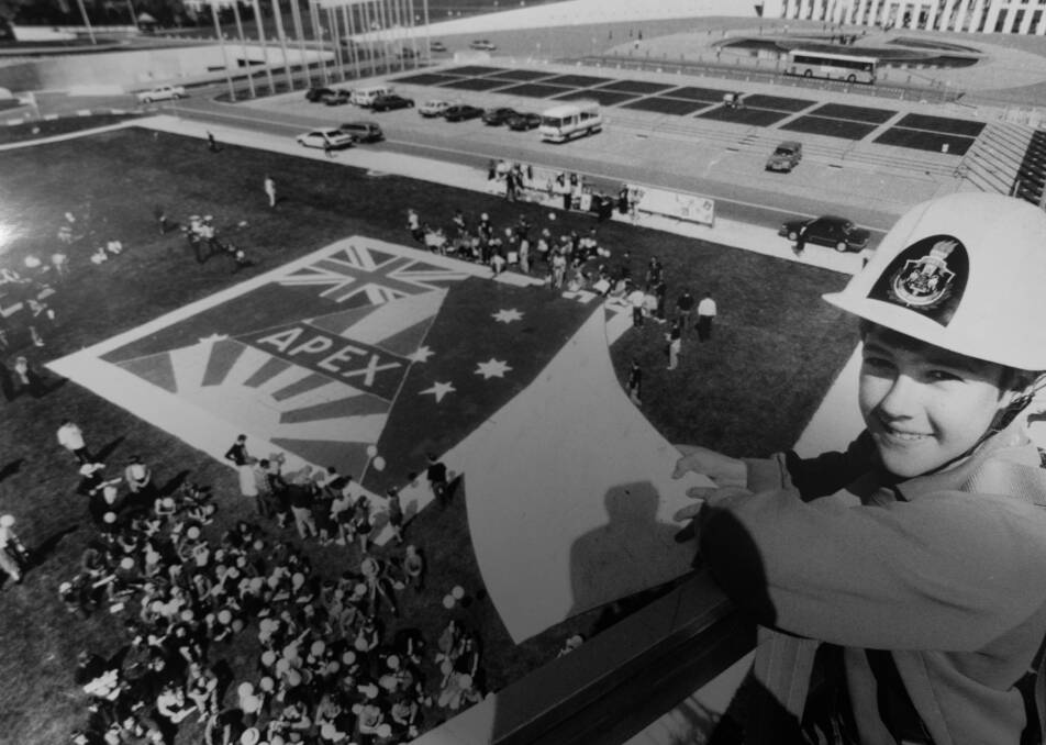 Leigh Barnett, 11, gets a bird's-eye view of the giant Apex jigsaw puzzle as school children put it together at Parliament House. 1993.