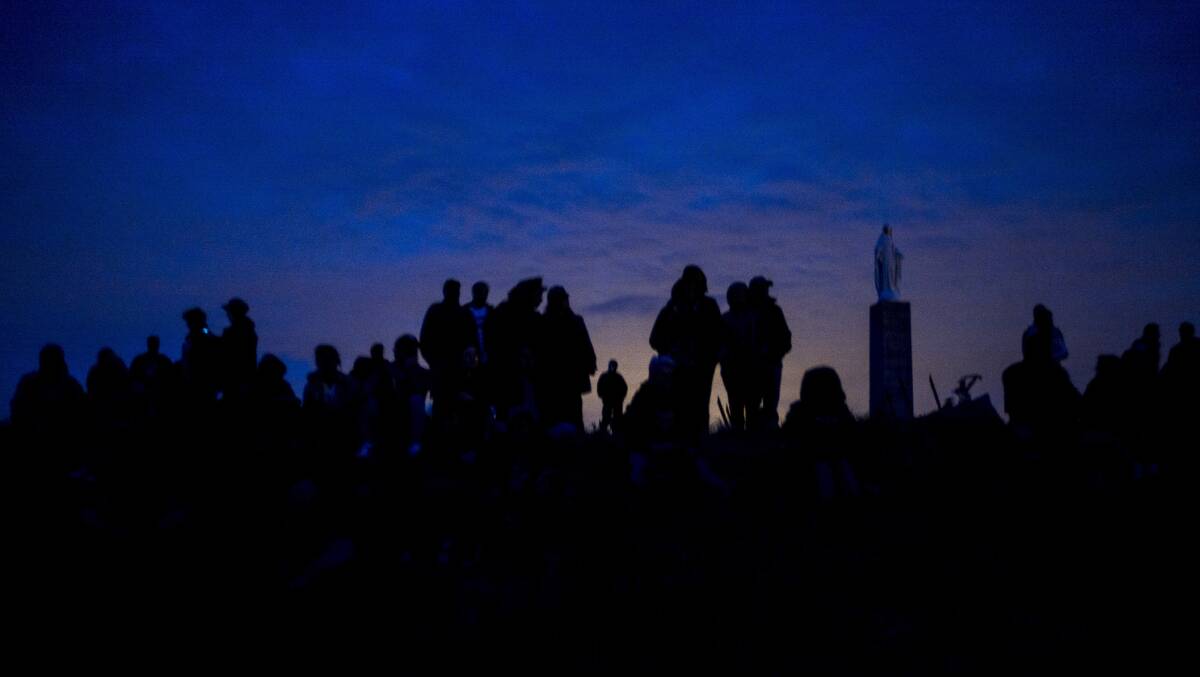 People watch fireworks at Normandy, France, on Thursday, where world leaders and veterans gathered to mark the 75th anniversary of the D-Day landings. Picture: AP Photo/Rafael Yaghobzadeh