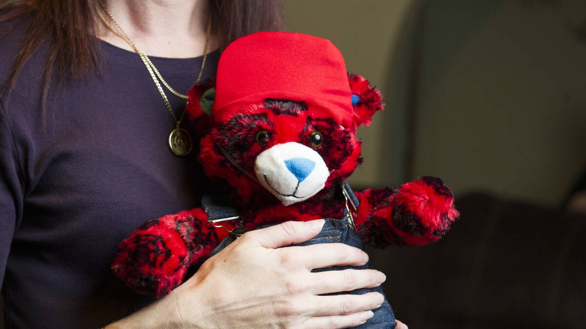 Canberra mum Carmen Barley placed the ashes of her young son, Logan Gee, inside a Spiderman teddy bear designed by the family. Picture: Dion Georgopoulos