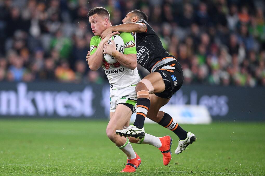 Jack Wighton of the Raiders is tackled by Benji Marshall of the Tigers. Picture: AAP