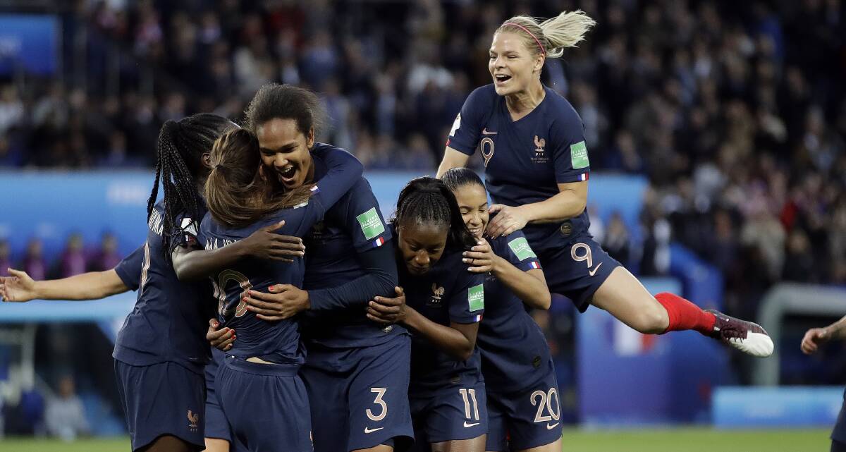 France's Wendie Renard, third from left, celebrates with teammates after scoring her second goal in the opening match of the FIFA Women's World Cup against South Korea. Picture: AP
