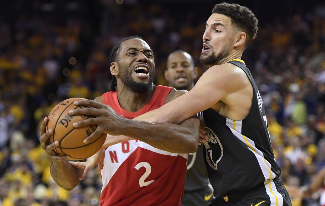 Toronto forward Kawhi Leonard (2) drives against Golden State guard Klay Thompson (11) in the Raptors' game four NBA finals win. Picture: AP