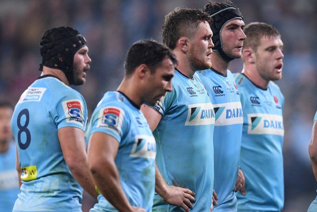 Dejected Waratahs players look on during their loss to the Brumbies. Picture: AAP