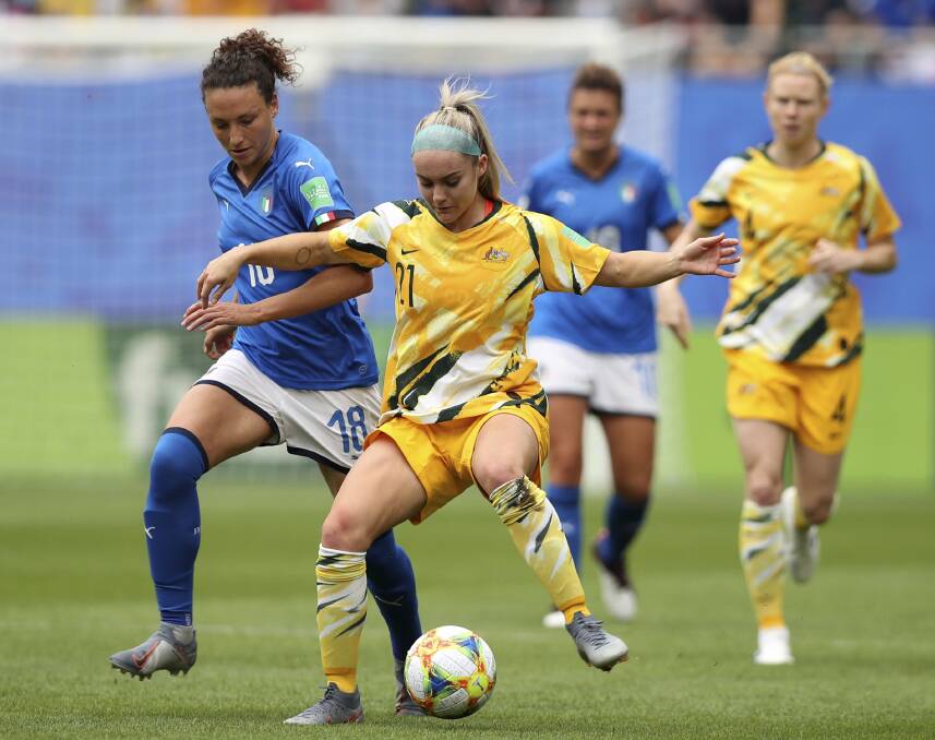 Italy's Ilaria Mauro, left, challenges Australia's Ellie Carpenter. The Canberra United defender was easily the Matildas' best. Picture: AP