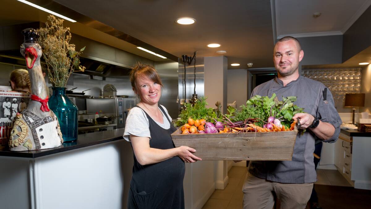 Brightside Produce owner Emily Yarra, from Captains Flat delivers fresh produce to Boffins Restaurant chef, Bernd Brademann. Picture: Elesa Kurtz