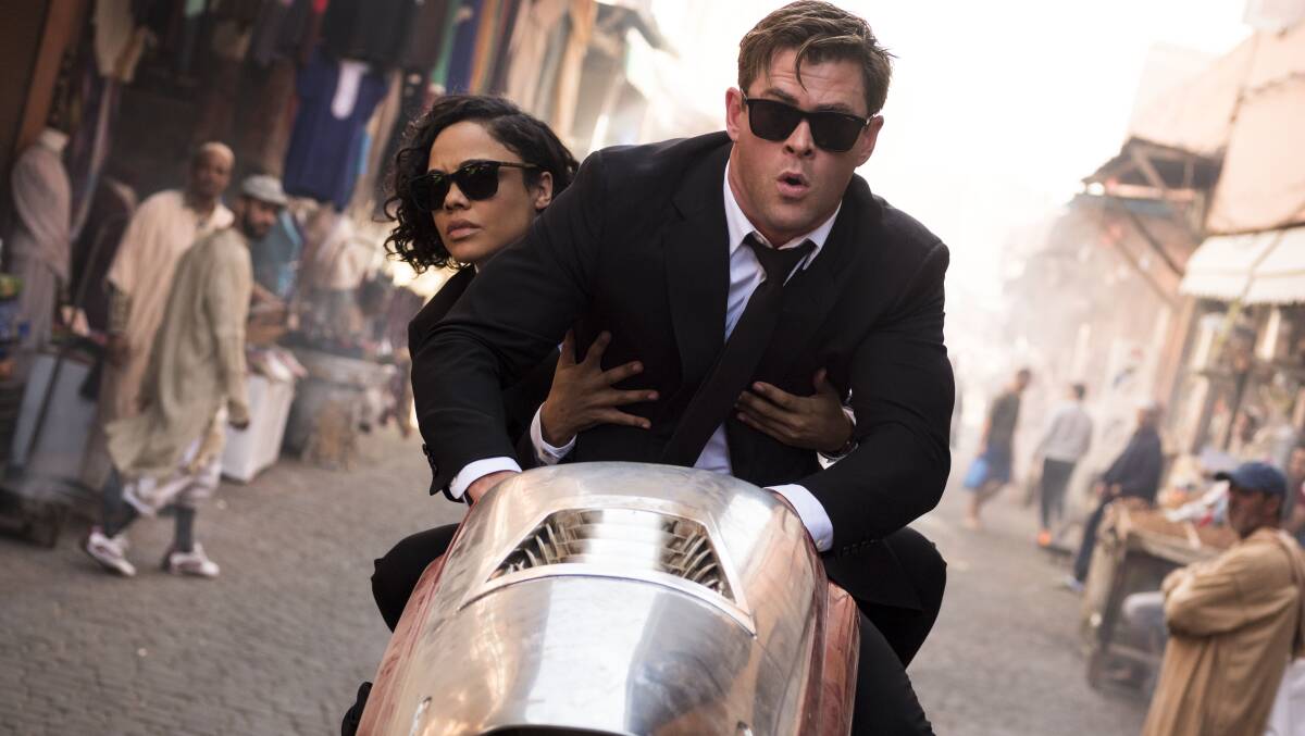 Chris Hemsworth, foreground, and Tessa Thompson in a scene from Men in Black: International. 