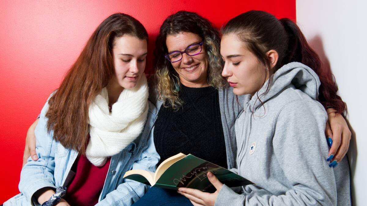 Pheobe Taylor with her daughters Hailie and Skylee who throughout their lives have had help from The Smith Family to improve their reading. Picture: Elesa Kurtz